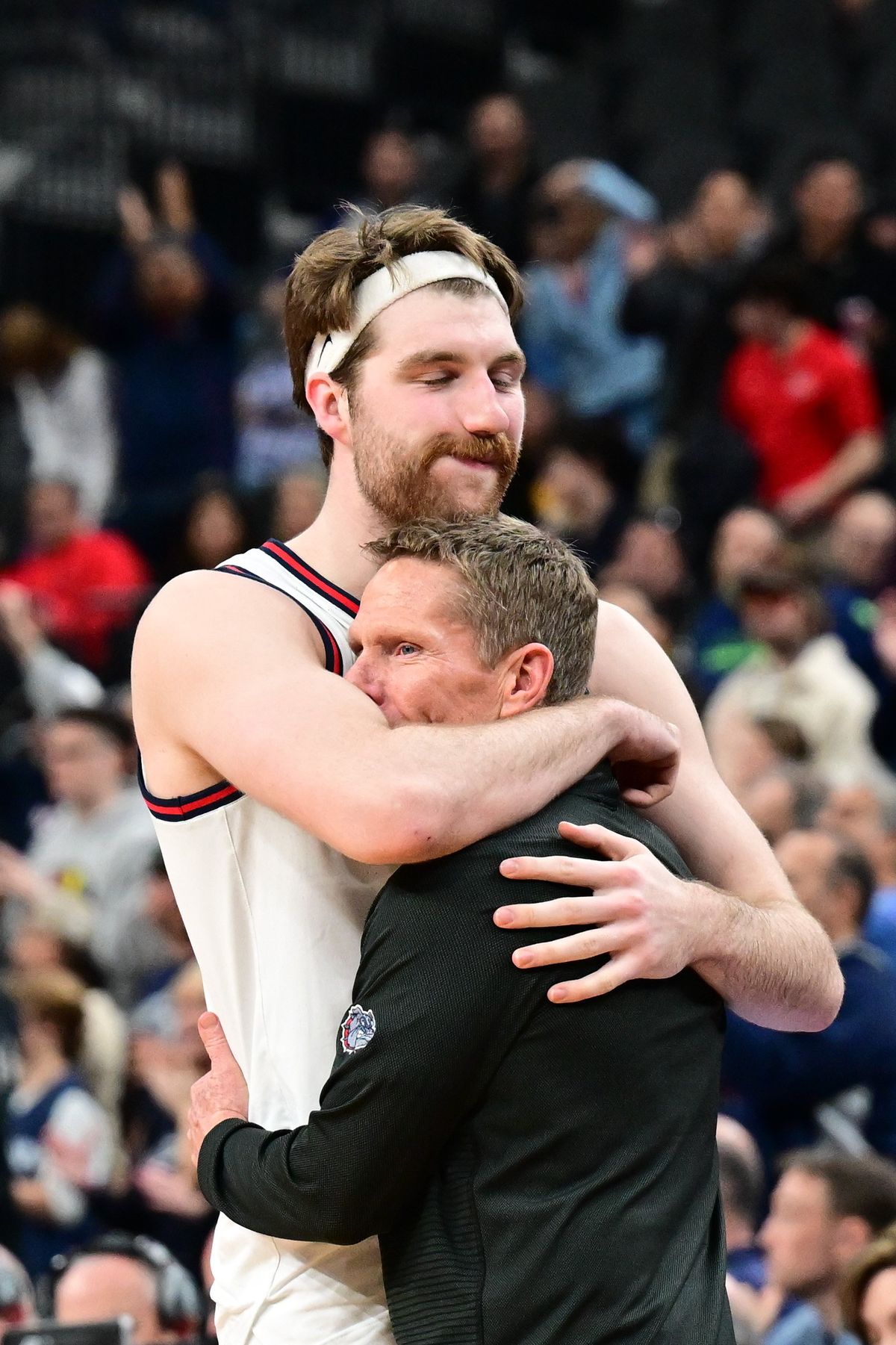 Gonzaga Bulldogs forward Drew Timme embraces head coach Mark Few after being taken out of the game late during a runaway loss in an NCAA Tournament Elite 8 basketball game against UConn on March 2 at T-Mobile Arena in Las Vegas. UConn held Timme to 12 points and won the game 82-54.  (Tyler Tjomsland/The Spokesman-Review)