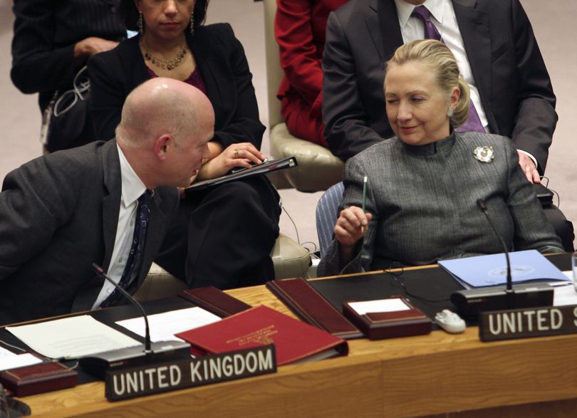 Secretary of State Hillary Rodham Clinton winks at British Foreign Secretary William Hague after he addressed a Security Council meeting on the situation in Syria on Tuesday. (Associated Press)