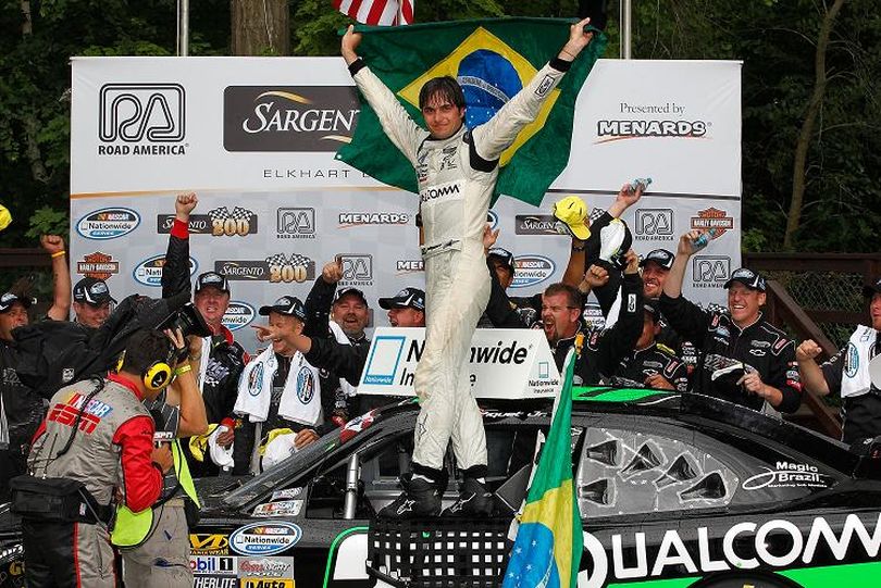 Nelson Piquet Jr. celebrates with his team in Victory Lane after winning the NASCAR Nationwide Series Sargento 200 at Road America on June 23 in Elkhart Lake, Wisc. (Photo Credit: Tyler Barrick/Getty Images for NASCAR) (Tyler Barrick / Getty Images North America)