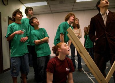 North Central High School freshman Jessica Bower, 14, bottom, watches her trebuchet launch on Tuesday at Spokane Falls Community College. 
 (Brian Plonka / The Spokesman-Review)