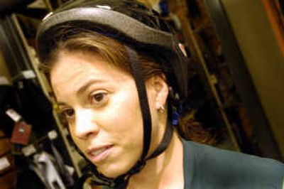 
Villegas wears an ill-fitted helmet. The front of the helmet should come about one inch above the eyebrows, the straps should be snug to just below the ears and the helmet should be snug on the head so it doesn't slip around.
 (Christopher Anderson/ / The Spokesman-Review)