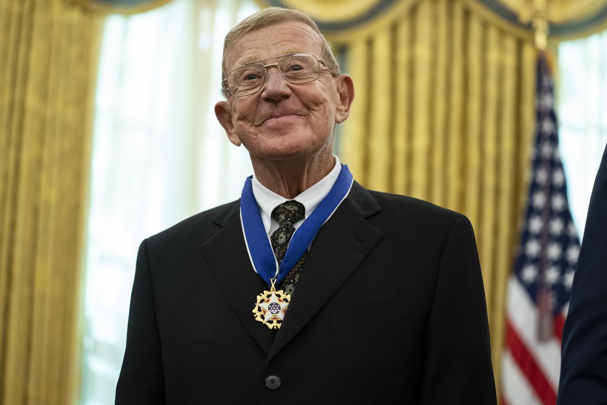 Former football coach Lou Holtz smiles after receiving the Presidential Medal of Freedom from President Donald Trump, in the Oval Office of the White House, Thursday, Dec. 3, 2020, in Washington. (Evan Vucci)