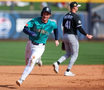 Mariners shortstop Colt Emerson runs the bases during a spring training game against the White Sox on Feb. 24 at Peoria Stadium in Peoria, Arizona.  (Tribune News Service)