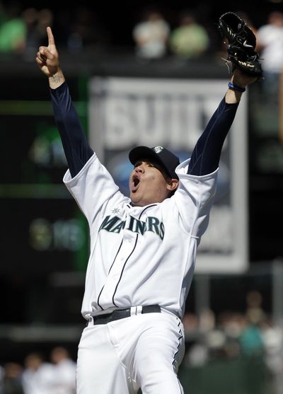 Seattle Mariners pitcher Felix Hernandez reacts after throwing a perfect game to end the ninth inning of baseball game against the Tampa Bay Rays, Wednesday, Aug. 15, 2012, in Seattle. The Mariners won 1-0. (Ted S. Warren / Associated Press)
