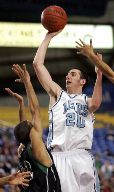 
CV's Luke Clift takes a shot during  the boys 4A  championship game in Tacoma in March. He has suffered from right knee injuries and has had surgery. Clift also plays football.
 (Associated Press / The Spokesman-Review)