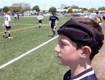 
Andrew Schutzer of the Albertson Arsenals wears a soccer helmet that protects from possible concussions. 
 (Newsday / The Spokesman-Review)