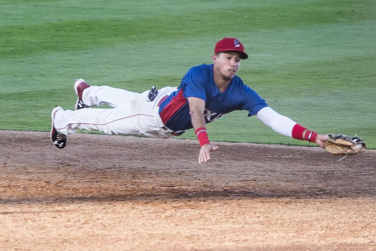 Spokane’s Elio Castillo goes horizontal to make a catch in the top of the fourth inning on Wednesday at Avista Stadium. (Tyler Tjomsland / The Spokesman-Review)