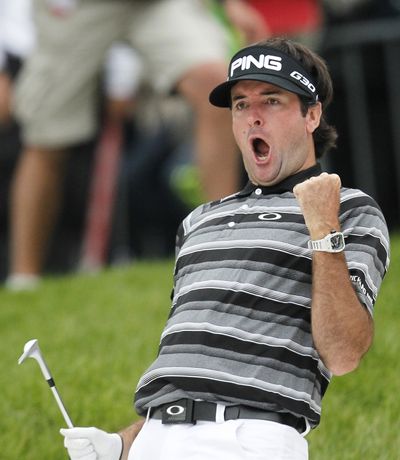 Bubba Watson is jubilant after making an eagle from a bunker on the 18th hole. (Associated Press)