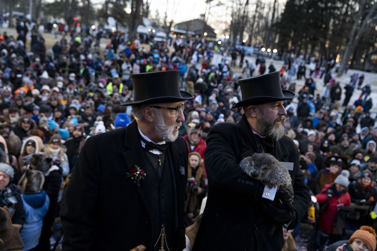 President Tom Dunkel and Groundhog handler AJ Derume with Punxsutawney Phil, who saw his shadow, predicting a late spring during the 137th annual Groundhog Day festivities on Feb. 2, 2023, in Punxsutawney, Pennsylvania. Groundhog Day is a popular tradition in the United States and Canada. A crowd of upwards of 5,000 people spent a night of revelry awaiting the sunrise and the groundhog