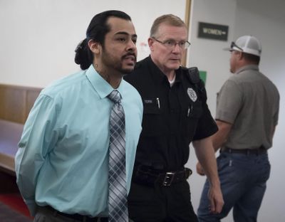 Stafone Fuentes, on trial for attempted murder, is led to the courtroom in Spokane on Tuesday, June 19, 2018. (Colin Mulvany / The Spokesman-Review)
