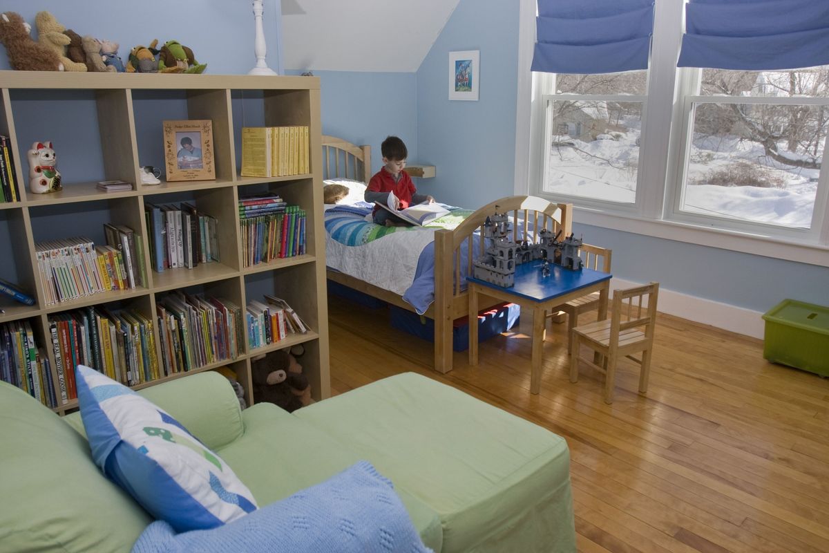 Parker Hirsch, 4, of Concord, N.H., reads in his redecorated room, which features plenty of storage cubes and a small table and chairs. Associated Press photos (Associated Press photos / The Spokesman-Review)
