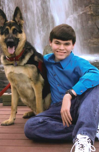 Jonathan Williams, a senior at Freeman High School, and his dog, Thor. Williams has a seizure disorder and sees a resource teacher in his home once a week.