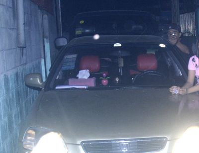 In this handout photo provided by the  Dagsa Family on Tuesday, Jan. 4, 2011, an alleged assassin aims a gun at  Reynaldo  Dagsa, who was taking a picture of his family early Jan. 1, 2011, just outside their residence at Caloocan city, north of Manila, Philippines. Police say  Dagsa was shot seconds later and died of his wounds. The photo was given to police by the family. Police said Wednesday that the man identified in the picture has not yet been arrested, correcting their earlier report he was in custody. The original photograph given to the police showed the three surviving family members smiling at the camera. The family, fearing further attacks, requested that the photograph be cropped to protect their identities. ( (AP Photo/ Reynaldo  Dagsa,))