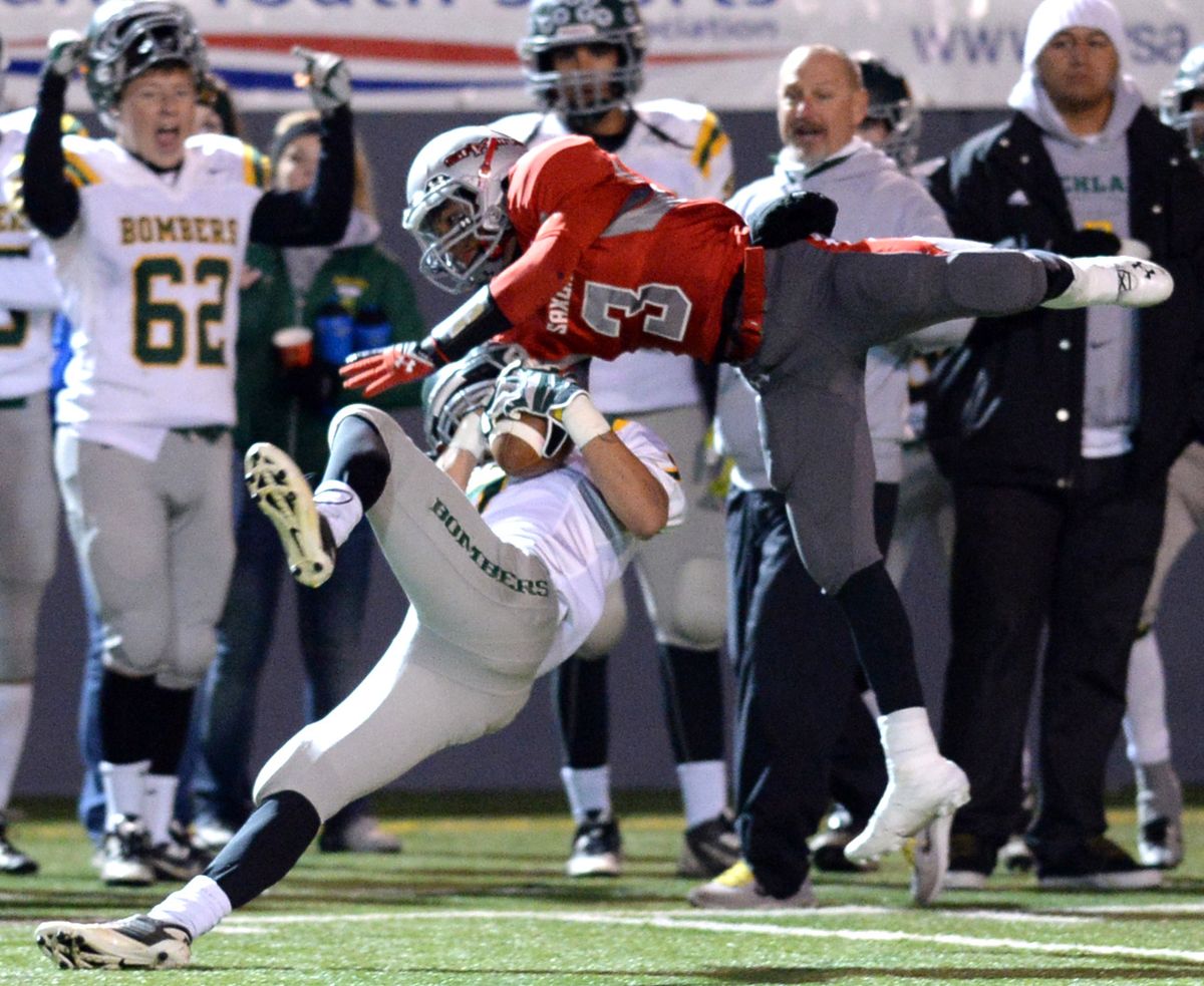 Richland’s Jesse Malone intercepts a pass intended for Ferris’ Jalen Hicks during Friday night’s State 4A play-in game at Albi Stadium. (Jesse Tinsley)
