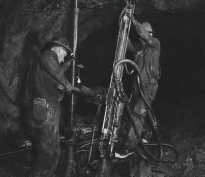 Miners setting up Rock Drills in The Bunker Hill Company Mine at Kellogg.  (1959 SR file photo)