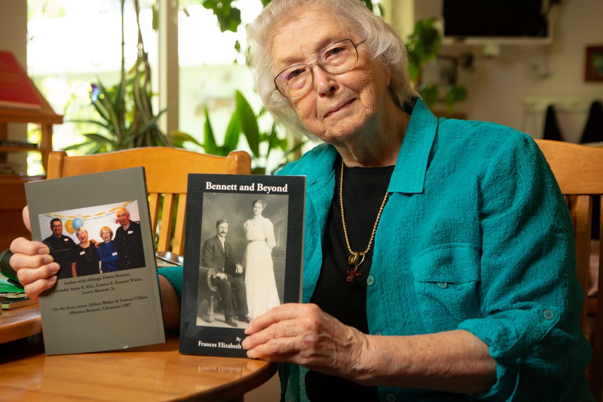 Fran Wicht poses with a copy of her recently-completed book, "Bennett and Beyond," at her home on July 8, 2021. Wicht's newest book is on her father but is far from the first book she authored, and it is actually book number four in her lineup from Spokane-based Gray Dog Press.  (Libby Kamrowski/ THE SPOKESMAN-REVIEW)
