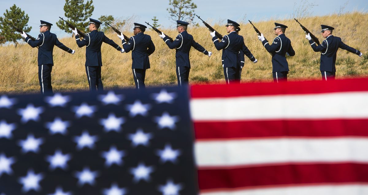 Members of the Fairchild Air Force Base Honor Guard fire off a 21-gun salute, honoring 46 veterans and one military spouse Tuesday at the Washington State Veterans Cemetery in Medical Lake. Their cremated remains had been unclaimed for years before the interment ceremony. (Colin Mulvany)