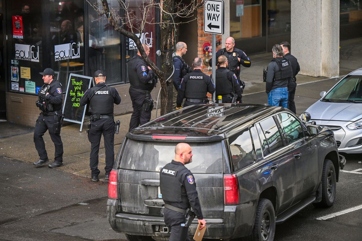 Police on the scene of police shooting on Howard Street Monday, Feb. 12, 2024, in downtown Spokane.  (DAN PELLE/THE SPOKESMAN-REVIEW)