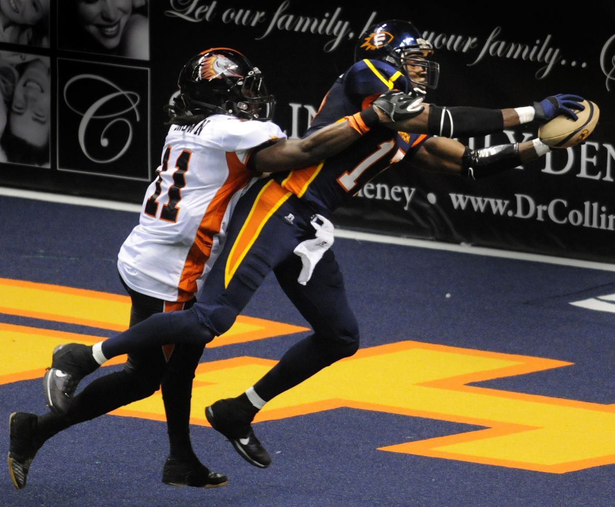 Huey Whittaker scores his thrid touchdown in the fourth quarter past Milwaukee's Carlton Brown (11) Friday April 2, 2010. (Colin Mulvany / The Spokesman-Review)