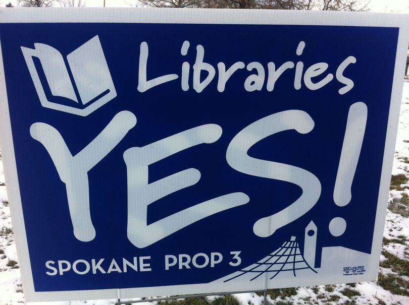 Yes for Spokane Libraries has paid for these signs in support of Proposition 3, a library lid lift that would prevent branch closures and likely extend hours at three of the city's six branches. (Jonathan Brunt)