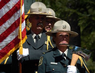 Rene McCormick of the Forest Service Honor Guard guards the flags at the dedication of the trail that will celebrate its namesake, Ed Pulaski. 
 (Jesse Tinsley / The Spokesman-Review)
