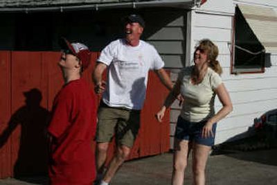 
Marcus, Shawn and Joanie Sloan play a little backyard basketball.
 (Steve Christilaw / The Spokesman-Review)