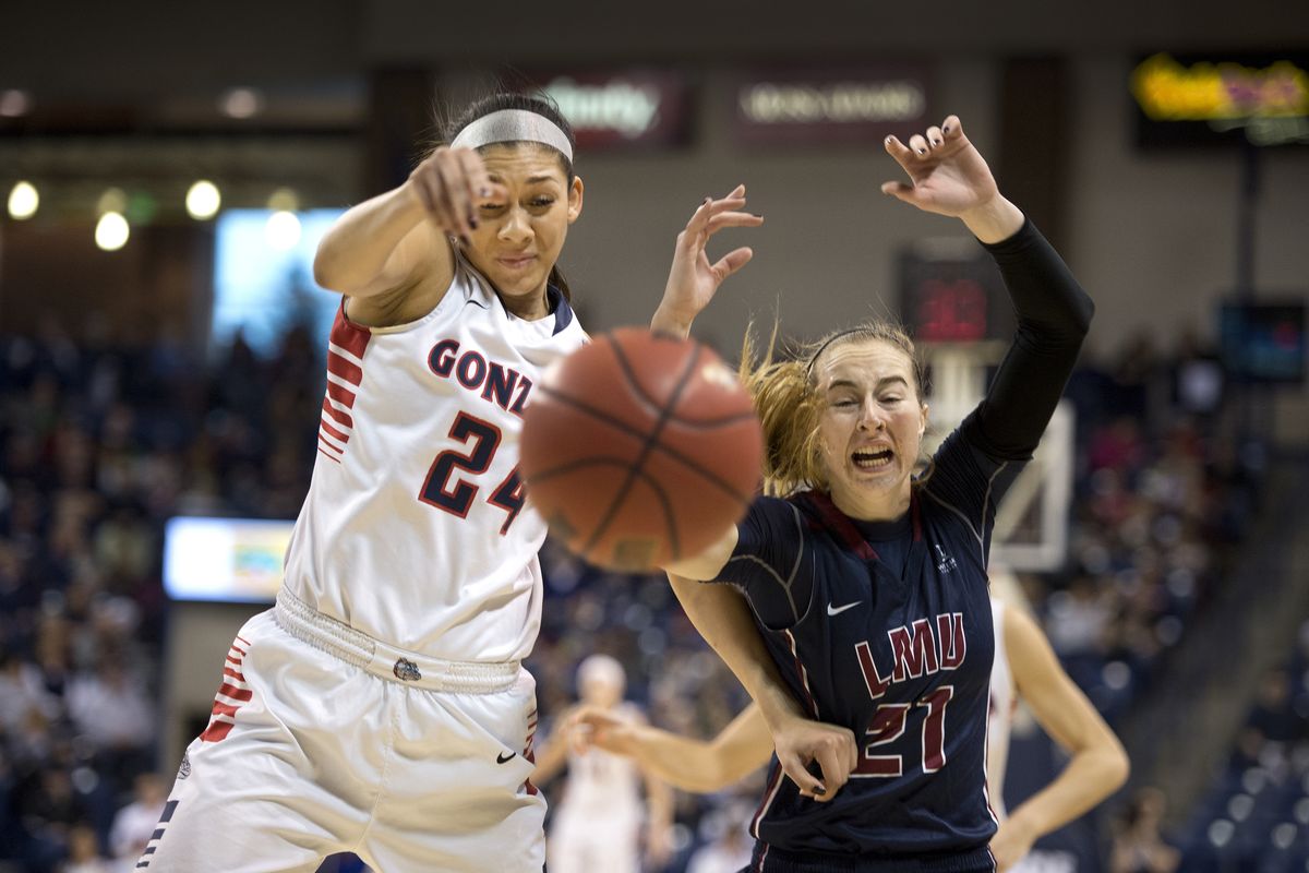 Gonzaga’s Keani Albanez slaps the ball away from Loyola Marymount’s Taylor Anderson during the first half of Saturday’s WCC victory. (Dan Pelle)