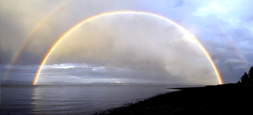 In this Monday, April 5, 2010 picture, a late afternoon rainbow appears briefly above Port Susan near Stanwood, Wash. (Frank Varga / Skagit Valley Herald)