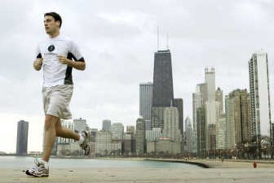 
With the Chicago skyline as a backdrop, a jogger takes advantage of Monday's unseasonably warm weather along Lake Michigan.
 (The Spokesman-Review)