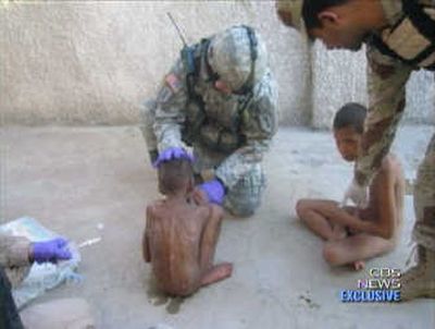 
This image made from video released by CBS News shows soldiers and children found this month in an orphanage in Baghdad. U.S. and Iraqi soldiers found 24 severely malnourished boys. Associated Press
 (Associated Press / The Spokesman-Review)