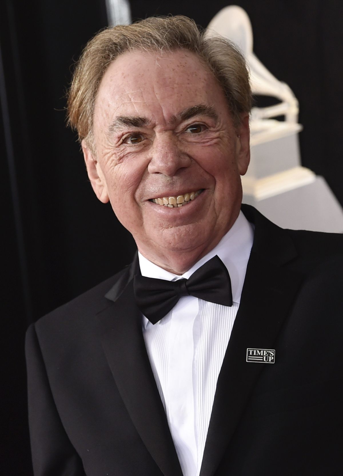 Composer Andrew Lloyd Webber arrives at the 60th annual Grammy Awards in New York on Jan. 28, 2018. A key prop from the smash musical “The Phantom of the Opera” will be auctioned along with other celebrity-donated items on April 28.  (Evan Agostini)