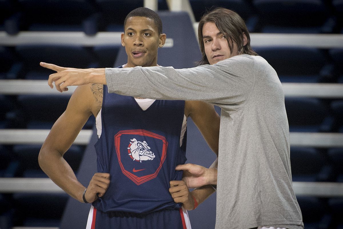 GU assistant Adam Morrison, right, has already made an impression on the players, including newcomer Angel Nunez. (Colin Mulvany)