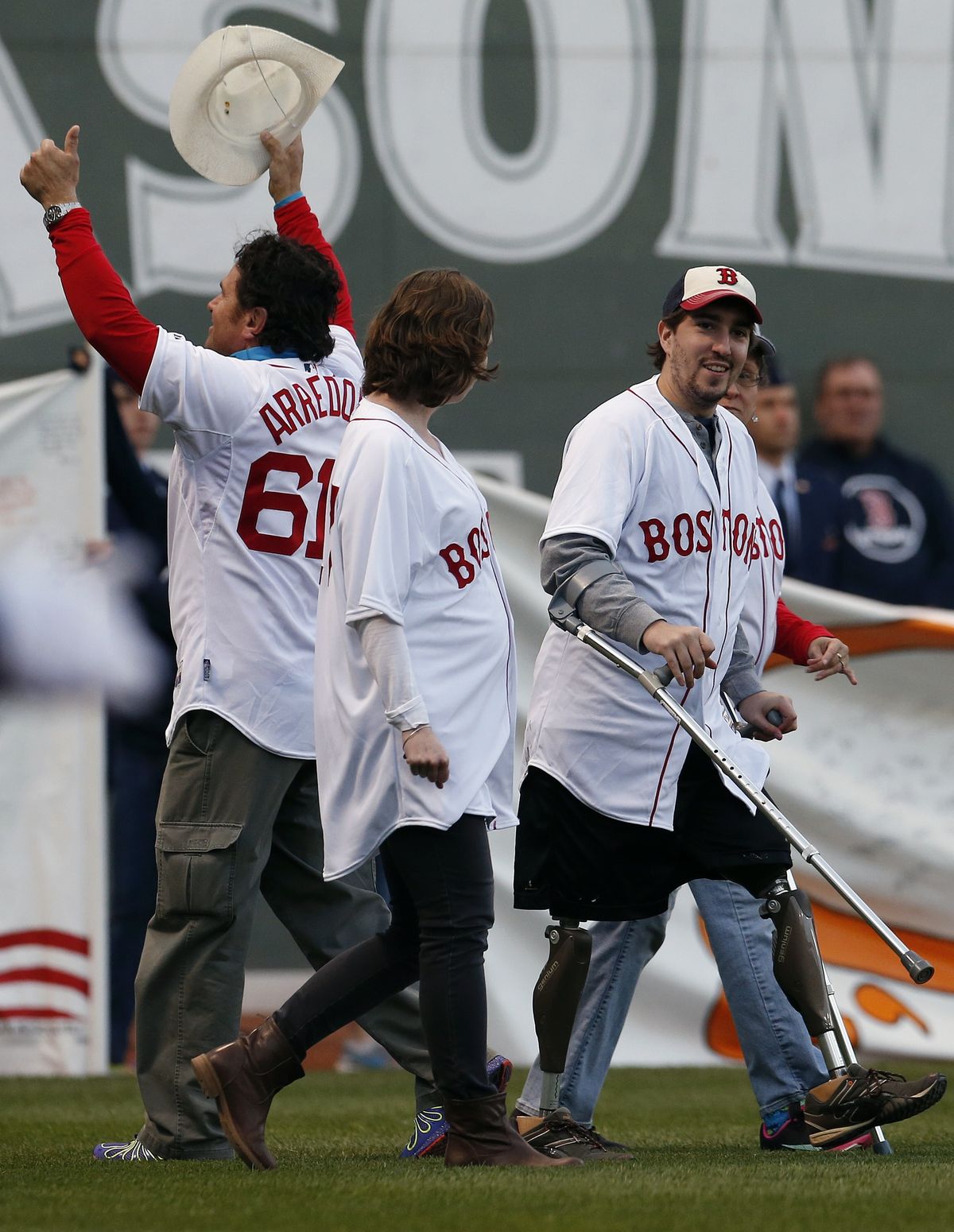Bombing survivors, including Jeff Bauman, right, and Carlos Arredondo, were honored at Fenway Park on Sunday. (Associated Press)