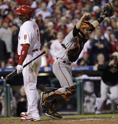 Phillies’ Ryan Howard looked at strike three, then couldn’t watch Buster Posey and the Giants celebrate. (Associated Press)