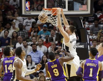 Miami Heat forward Josh McRoberts (4) dunks against the Los Angeles Lakers during the first half of an NBA basketball game, Thursday, Dec. 22, 2016, in Miami. (Alan Diaz / Associated Press)