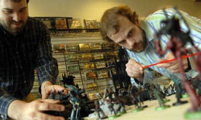 
Owners of The Spot, Brandon Jank, left, and Steve Otten prepare to play a game of Warhammer 40,000 at their store in Hayden on May 7. the Spokesman-Review
 (KATHY PLONKA the Spokesman-Review / The Spokesman-Review)