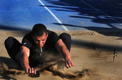 
Lewis and Clark's Levi Taylor took first in the 4A triple jump despite spraining an ankle Wednesday, landing with a winning mark of 45 feet, 91/2 inches.
 (Rajah Bose / The Spokesman-Review)