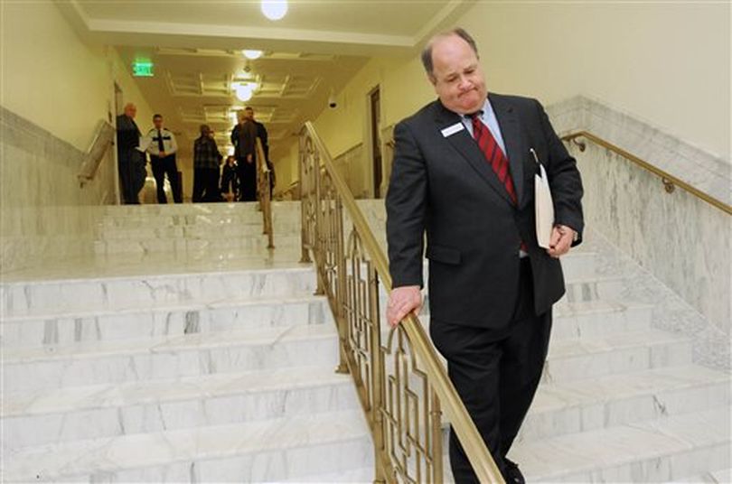 This Feb. 22, 2012 file photo, Sen. Bart Davis walks down the stairs to the garden level of the Idaho State Capitol, for a news conference in Boise, Idaho. Davis and his wife, Marion, know grief, having buried their 23-year-old son.They’ve come to know forgiveness, too. At an April 9 parole hearing, Davis told Idaho’s parole commission they wouldn’t oppose the release of the man who killed their boy, Cameron Wade Davis, in March 2003. Though a hearing officer recommended against paroling Craig Olsen so soon, Davis’ words helped tip the balance, clearing the way for the now 32-year-old Olsen to serve the remainder of his 25-year manslaughter sentence on the outside. (AP/Idaho Press-Tribune / Greg Kreller)