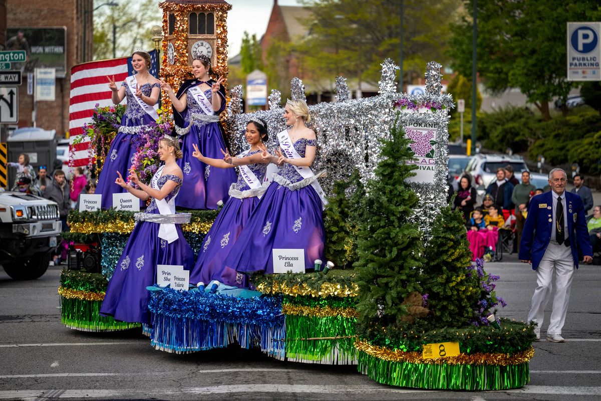 The Lilac Festival float with queen and court turns onto Sprague Avenue Saturday during the Spokane Lilac Festival’s Armed Forces Torchlight Parade in downtown Spokane.  (COLIN MULVANY/THE SPOKESMAN-REVIEW)