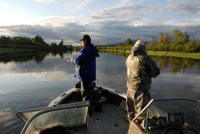 
Seth Burrill of the Angler's Xperience and cameraman Randy Johnson continue fishing for northern pike after a storm on the Pend Oreille River. 
 (Photos by RICH LANDERS / The Spokesman-Review)