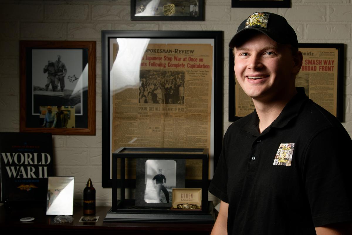 Gonzaga student Scott Davis poses for a photo Aug. 13 at his home in Spokane. Davis is on a mission to collect and preserve oral histories of the men and women who served during World War ll and the Korean War. His project is titled “Faces of Valor,” and he recently launched a podcast so that others can hear these stories told in their own words by the people who served. (Tyler Tjomsland / The Spokesman-Review)