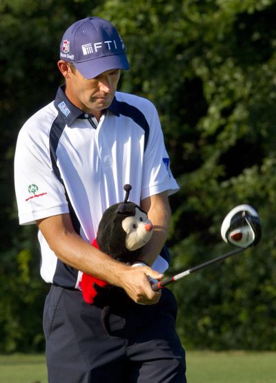 Padraig Harrington, of Ireland,  uses one of his wood covers to aid with his arm position while practicing on the driving range during the Pro-Am of the Wyndham Championship,  at Sedgefield Country Club in Greensboro, N.C., Wednesday, Aug. 17, 2011. (Joseph Rodriguez / News & Record)