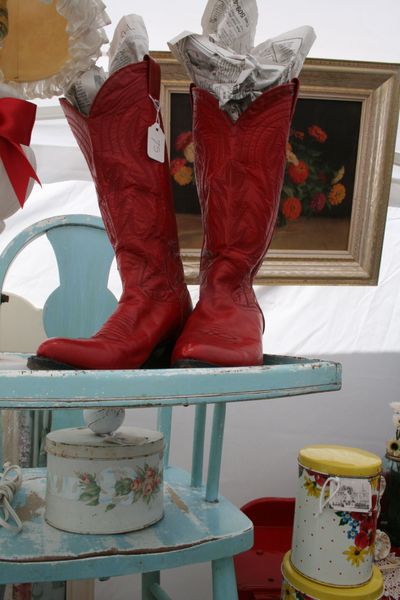 A pair of red boots are among the vintage treasures for sale in a booth run by the businesses Rose Cottage and Forget Me Not at the Latah Creek Variety Market. The event runs June 20 and 21 from 10 a.m. to 4 p.m. (Megan Cooley / The Spokesman-Review)