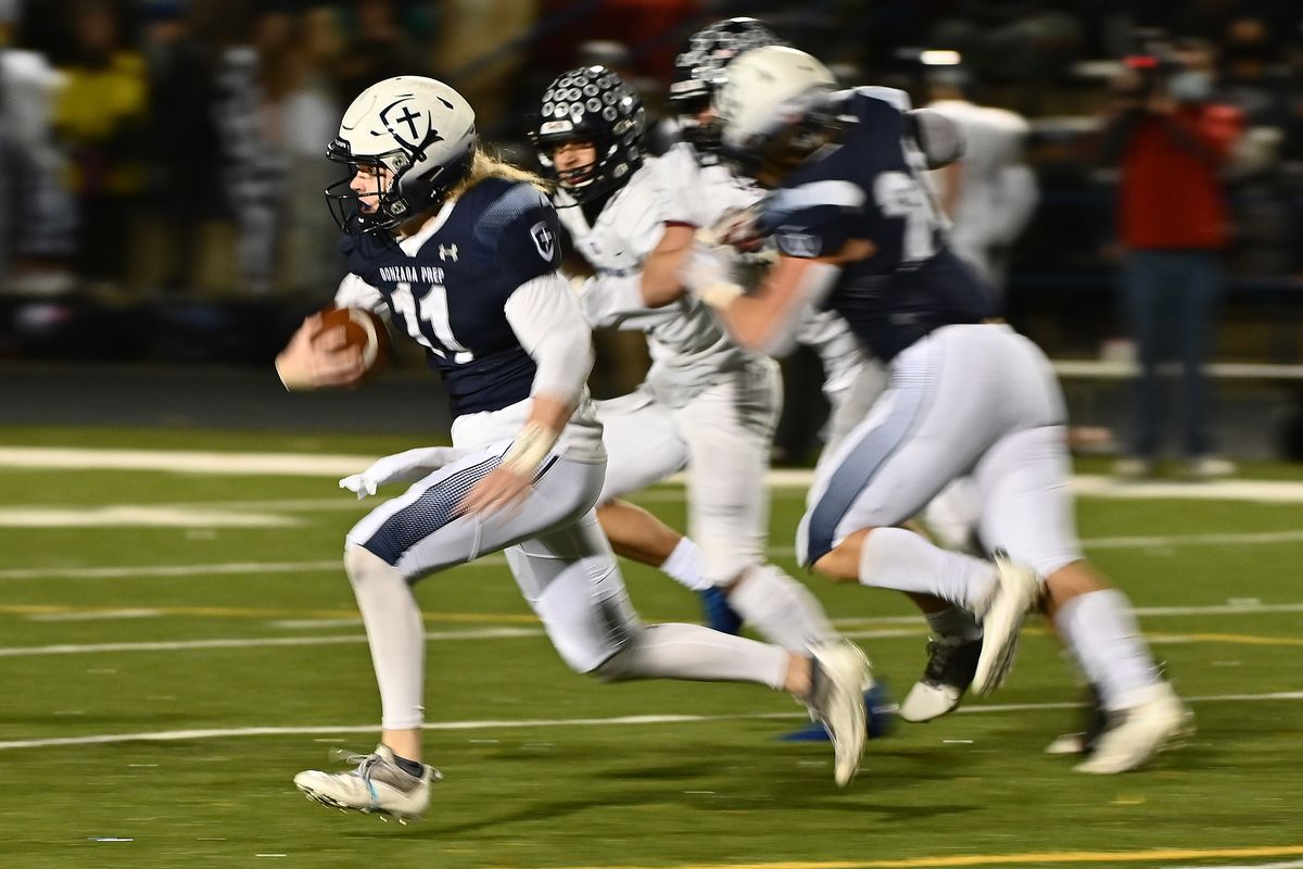 Gonzaga Prep quarterback Ryan McKenna breaks away for a touchdown against Mt. Spokane during a Greater Spokane League game at Bullpup Stadium on Friday.   (James Snook/For The Spokesman-Review)