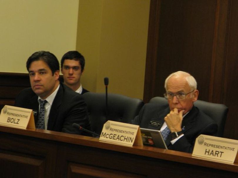 Reps. Raul Labrador, R-Eagle, left, and Darrell Bolz, R-Nampa, right, listen to testimony at the hearing on HB 500, the tribal law enforcement bill, on Thursday. (Betsy Russell)