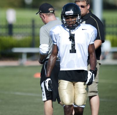 Idaho coach Paul Petrino, back left, appears to have receiver Dezmon Epps’ back again and again. (Tyler Tjomsland)