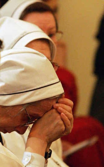 
Three nuns wait for a special Mass held Saturday at the Chapel at Polyclinic Gemelli Hospital in Rome for Pope John Paul II.
 (Associated Press / The Spokesman-Review)