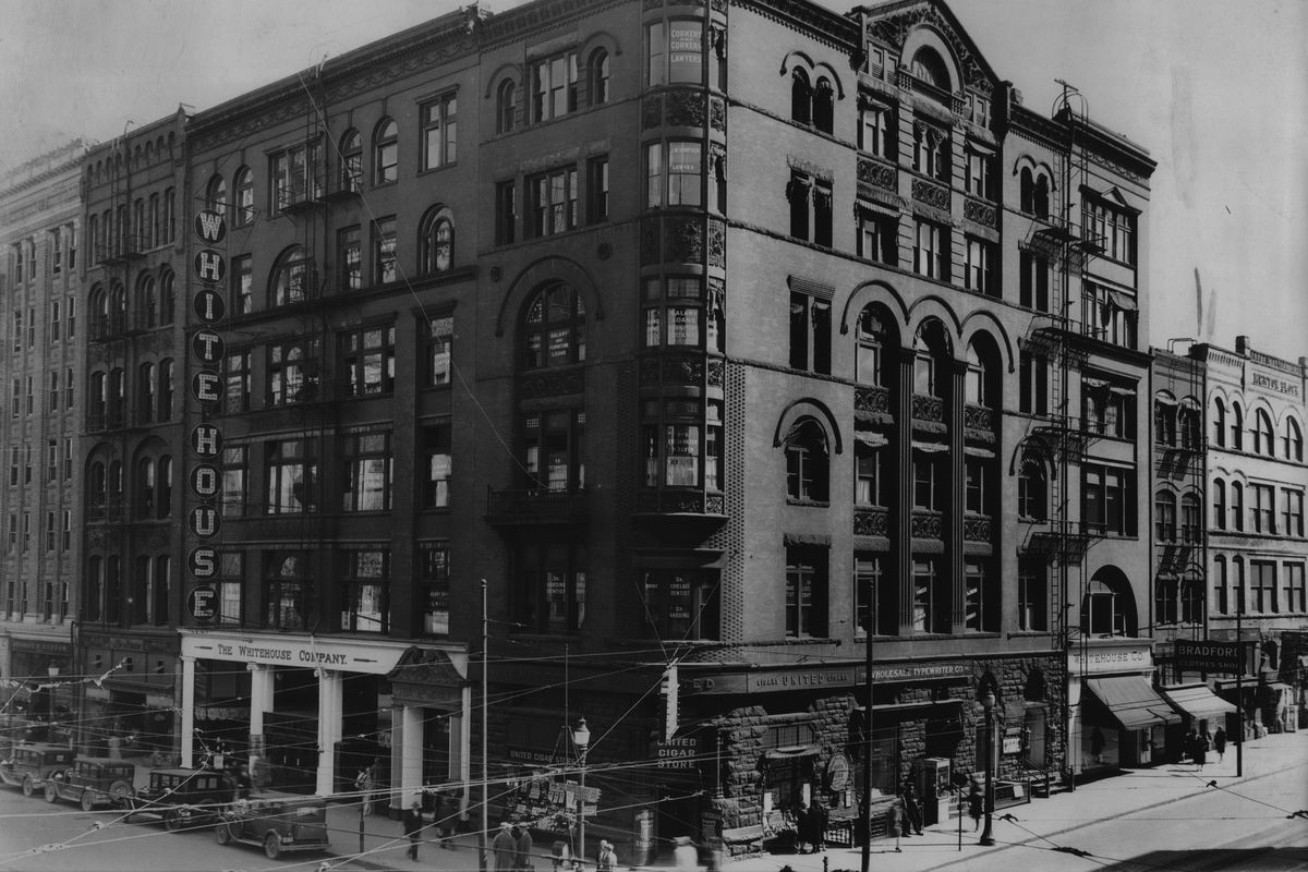 1920s: Four connected structures made up the Rookery Building, mostly completed in 1890 after the catastrophic fire of 1889, on the corner of Riverside Avenue and Howard Street. The rounded corner, built for short-lived Spokane National Bank, is shown here with the United Cigar Store at ground level. The Whitehouse Company, a department store with entrances on both Riverside and Howard, wrapped around the bank. The complex was a warren of narrow hallways and small offices, giving rise to the name “rookery,” which is the term for a group of bird nests.  (THE SPOKESMAN-REVIEW PHOTO ARCHIVE)