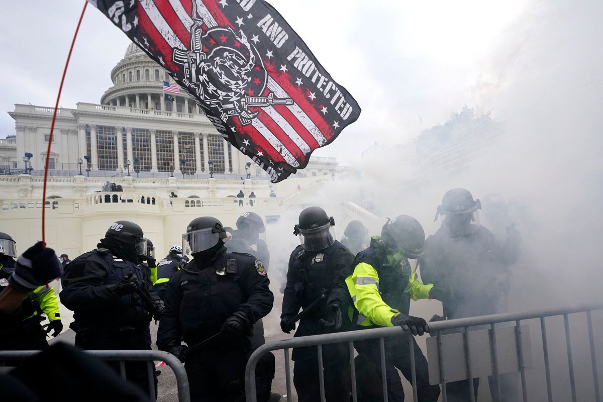 Police hold off violent insurrections loyal to then-President Donald Trump as they try to break through a police barrier Jan. 6, 2021, at the Capitol in Washington. Intelligence reports compiled by the U.S. Capitol Police in the days before last year
