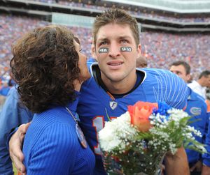 FILE - In this Nov. 28, 2009, file photo, Florida quarterback Tim Tebow embraces his mother, Pam, during a pre-game ceremony for graduating seniors on the Florida football team prior to an NCAA college football game against Florida State in Gainesville, Fla. CBS responded to complaints over a conservative group's planned Super Bowl ad featuring football star Tim Tebow and his mother Pam by saying that it had eased restrictions on advocacy ads and would consider "responsibly produced" ones for open spots in its Feb. 7 broadcast.   CBS said Tuesday, Jan. 26, 1010,  it had received numerous e-mails _ both critical and supportive _ since a coalition of women's groups began a protest campaign Monday against the ad, which the critics say will use Tebow and his mother to convey an anti-abortion message. (Phil Sandlin / Pool Fr117487 Ap)